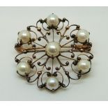 A 14ct gold Victorian brooch set with pearls in a floral decoration, 3.4cm, 5.