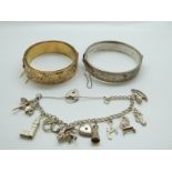 A silver charm bracelet with 11 charms, a hallmarked silver bangle and a rolled gold bangle.