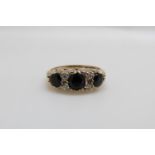 A 9ct gold ring set with sapphires (size M)