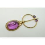 A gold scarf pin set with amethyst cabochons, marks indistinct, 5.8 x 2.