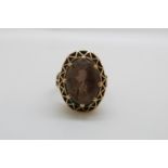 A 9ct gold ring set with a large smoky quartz (size N)