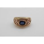 A 9ct gold Clogau ring set with an oval sapphire in a pierced setting (size L/M)