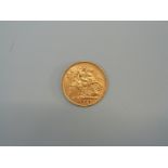 A 1909 gold half sovereign.