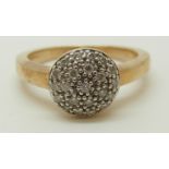 A 9ct gold ring set with diamonds in a circular setting, 4.