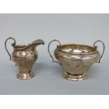 A hallmarked silver cream jug and sucrier, Birmingham 1919 maker G. M. Co.