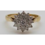 An 18ct gold ring set with diamonds in a cluster, total diamond weight approximately 0.