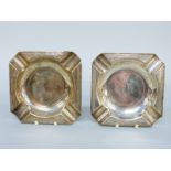 A pair of hallmarked silver ashtrays with engine turned borders, Birmingham 1911 maker H F Withers,