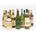 Twelve bottles of white wine and other alcohol to include 1975 Lutomer Laski Riesling, 1992 Soave,