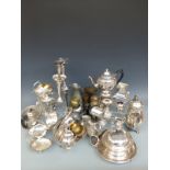 A quantity of silver plated items to include trumpet vases, serving dishes, brassware,