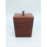 An oak tea caddy with amboyna or similar burr wood veneer,