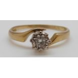 An 18ct gold ring set with a diamond, 3.