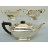 An Art Deco George VI hallmarked silver three piece tea set, London 1938, maker Kemp Brothers,