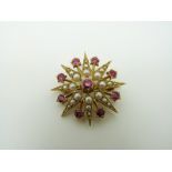 A 9ct gold Edwardian pendant/ brooch set with seed pearls and rubies in a star setting, 2.