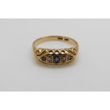 An 18ct gold ring set with sapphires and diamonds (size O)