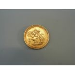 An 1817 George III gold full sovereign with laureate head
