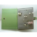 A collection of silver earrings including pearl set, moss agate,
