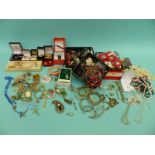 A collection of costume jewellery including beads, agate necklaces, silver rings, silver bangle,