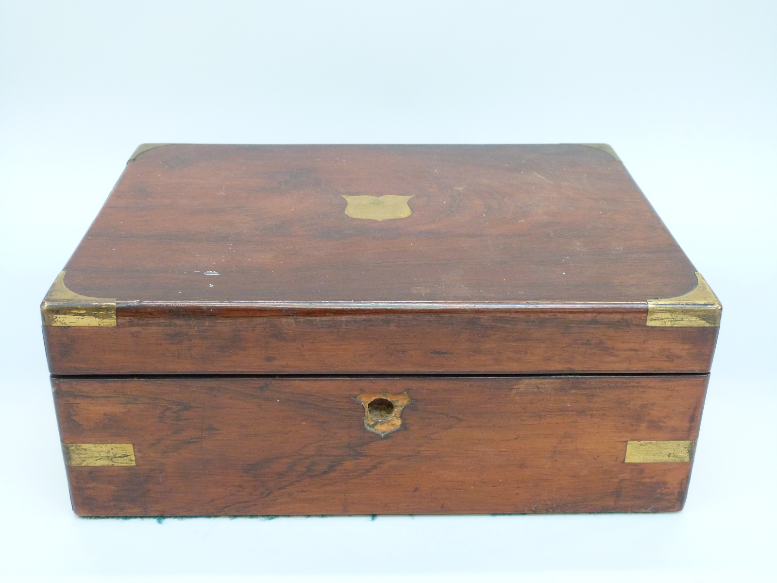 A 19thC brass inlaid rosewood writing slope with inset baize writing surface,