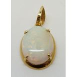 An 18ct gold pendant set with a white opal