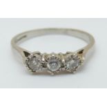 An 18ct white gold ring set with three diamonds, total diamond weight 0.