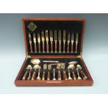 A Regency bronze and rosewood 44-piece canteen of cutlery