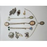 A collection of silver jewellery to include silver brooches, amethyst brooches, cameos,