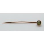 A Victorian stick pin set with a chrysoberyl cat's eye cabochon, 5.5cm, cabochon 0.