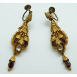 A pair of Victorian pinchbeck repoussé earrings set with foiled garnets and paste