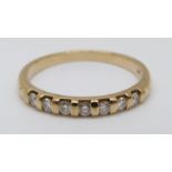 A 9ct gold half eternity ring set with diamonds, 1.