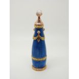 A guilloche enamel scent or perfume bottle with gold mounts set with old cut diamonds and a