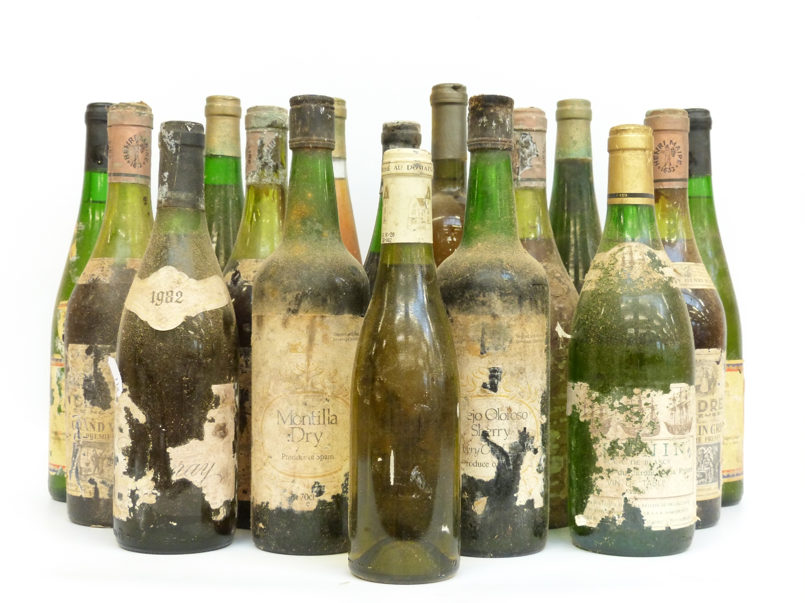 Sixteen bottles of vintage wines, some with missing labels,