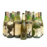 Sixteen bottles of vintage wines, some with missing labels,