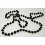 A beaded black onyx necklace and bracelet with 14ct gold beads