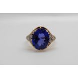 An 18ct gold ring set with an oval tanzanite of approximately 5.