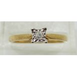 A 9ct gold ring set with a diamond in a square setting, 2.