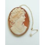 A 9ct gold brooch set with a cameo depicting a lady