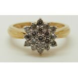 An 18ct gold ring set with diamonds in a cluster, total diamond weight approximately 0.5ct, 3.