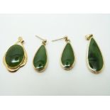 A 9ct gold pendant set with jadite and matching earrings