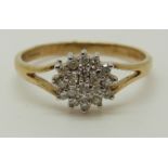 A 9ct gold ring set with diamonds in a cluster, total diamond weight approximately 0.25ct, 1.