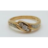 An 18ct gold ring set with diamonds totalling approximately 0.22ct in a twist setting 2.