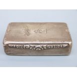 A George V hallmarked silver Georgian style snuff box with engine turned decoration,