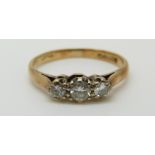 An 18ct gold ring set with three diamonds, total diamond weight approximately 0.35ct, 1.