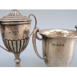 A small hallmarked silver lidded trophy cup, height 10.