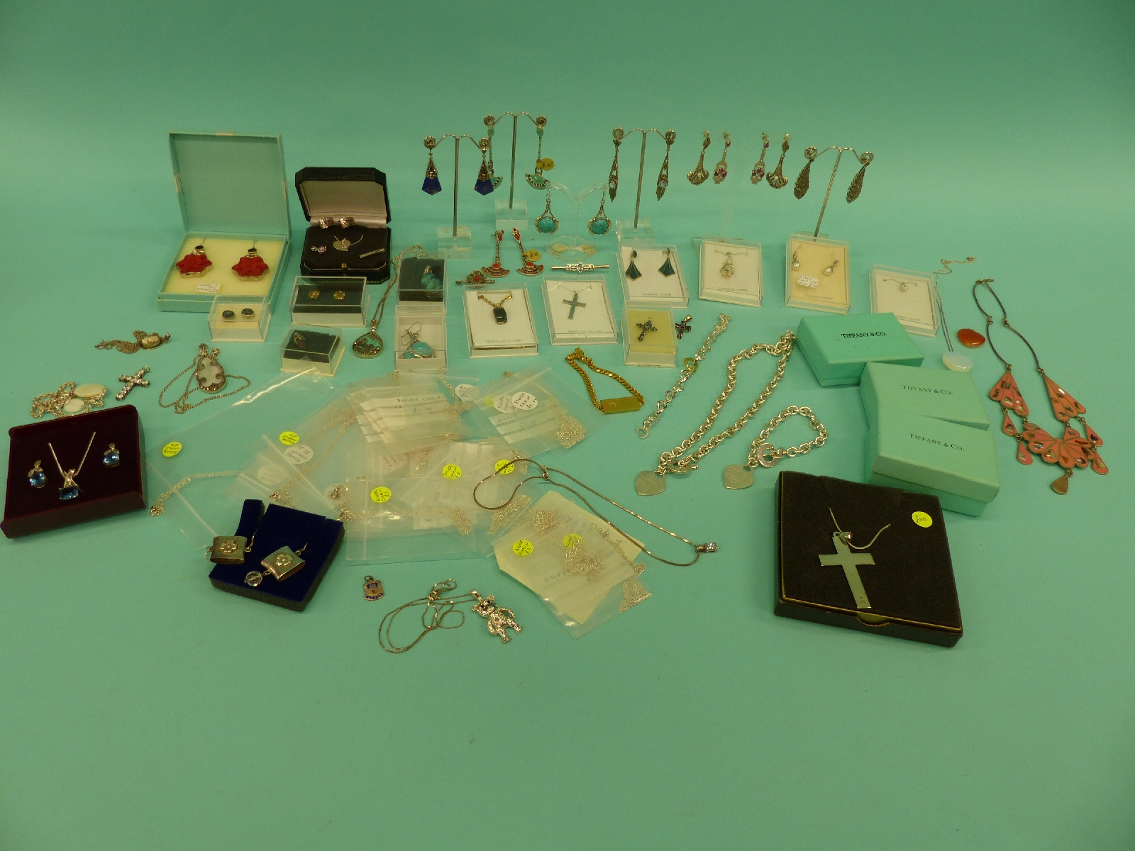 A collection of costume jewellery to include a large quantity of silver jewellery including enamel