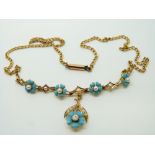 An Edwardian 18ct gold necklace set with seed pearls, blue enamel flowers and an old cut diamond, 9.