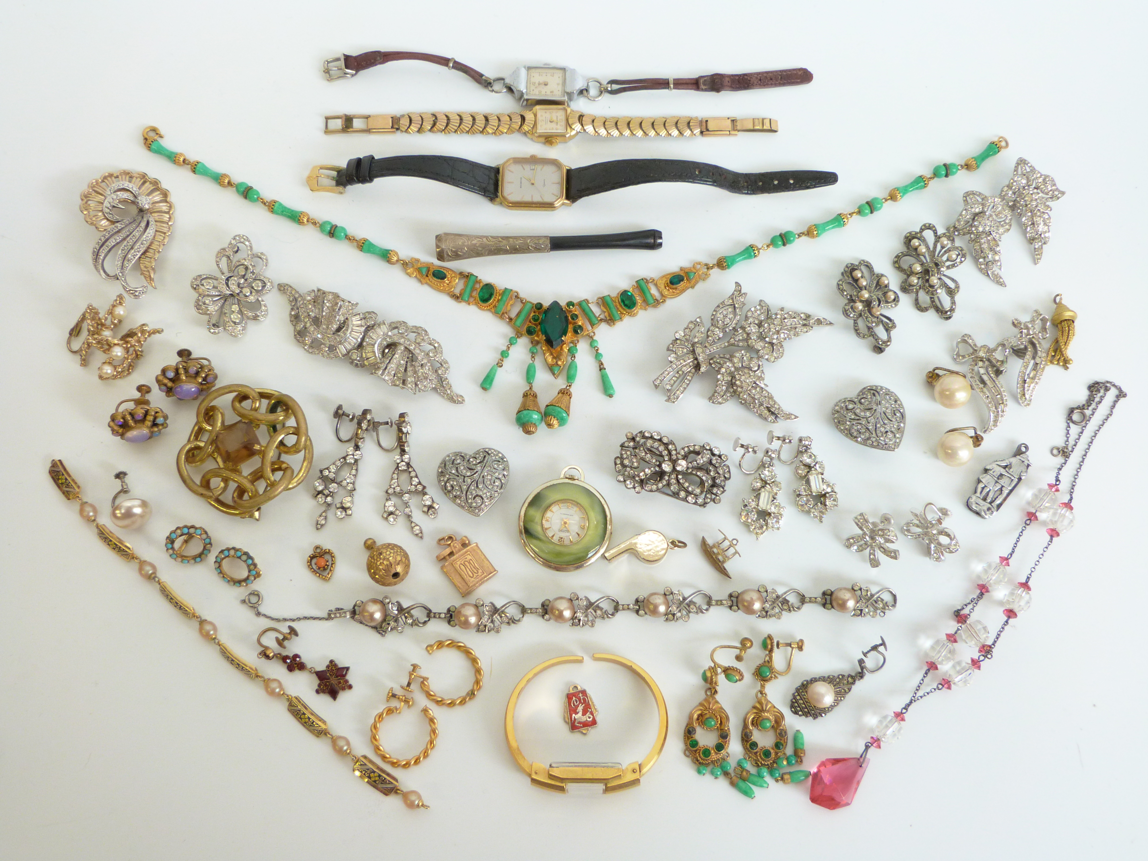 A collection of costume jewellery to include Victorian silver and paste metamorphic brooch with