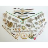 A collection of costume jewellery to include Victorian silver and paste metamorphic brooch with