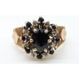 A 9ct gold ring set with sapphires and diamonds (size K)