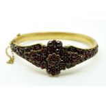 A Victorian bangle set with Bohemian garnets