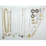 A collection of silver jewellery to include tigers eye earrings and a pendant, two silver rings,